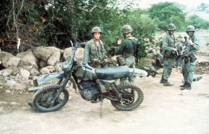 1362544547_USArmypersonnelstandbehindascoutmotorcycleduringOperationURGENTFURYUSNationalArchives.png.b318c44a9117d26292c67c9dee0b9226.png